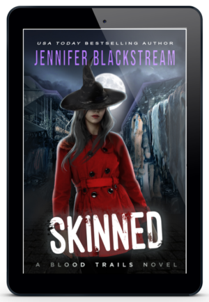 Skinned, book sixteen in Jennifer Blackstream's Blood Trails series, featured on an ereader.